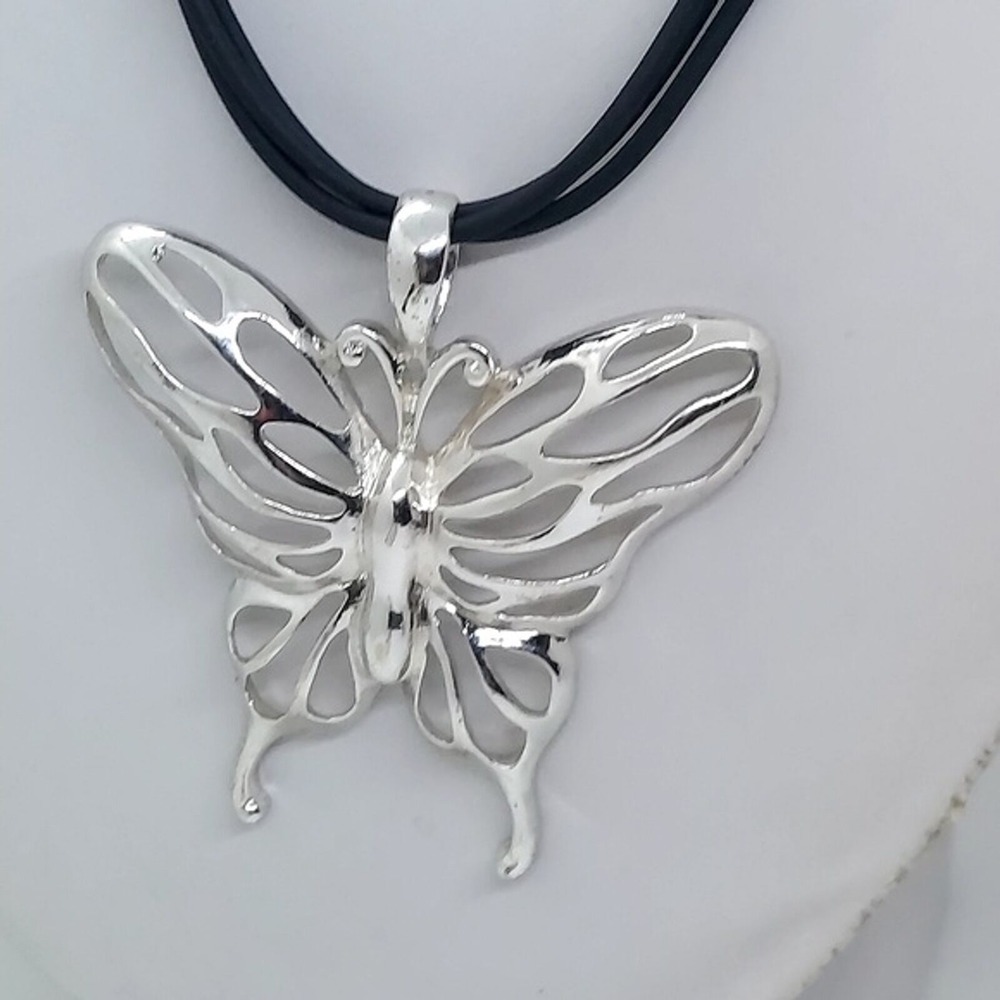 Silver tone open work butterfly cord necklace